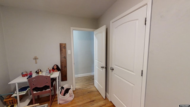 corridor featuring light hardwood / wood-style floors