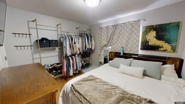 bedroom with hardwood / wood-style flooring