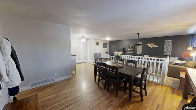 dining area featuring ceiling fan and light hardwood / wood-style floors