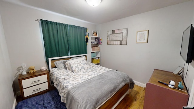 bedroom featuring hardwood / wood-style flooring