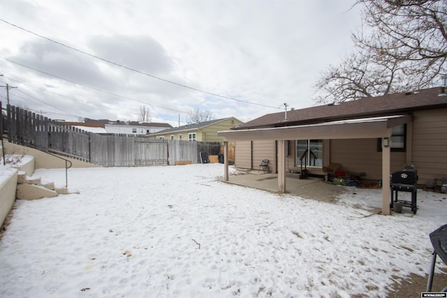 view of yard covered in snow