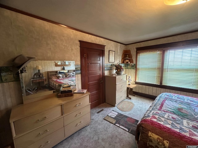 bedroom featuring light carpet and crown molding