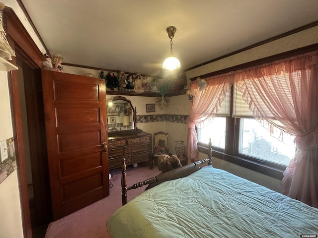 carpeted bedroom with ornamental molding