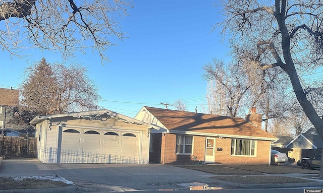 ranch-style home featuring a garage