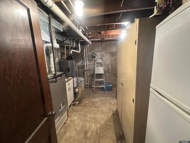 basement featuring white fridge