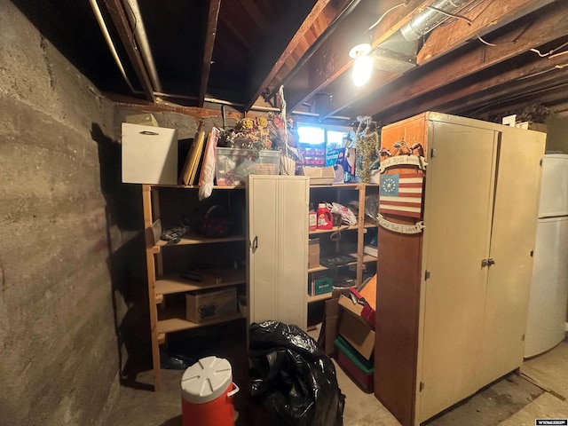 basement with white refrigerator