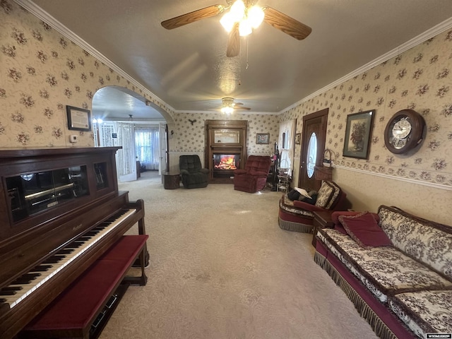 interior space featuring ornamental molding and ceiling fan