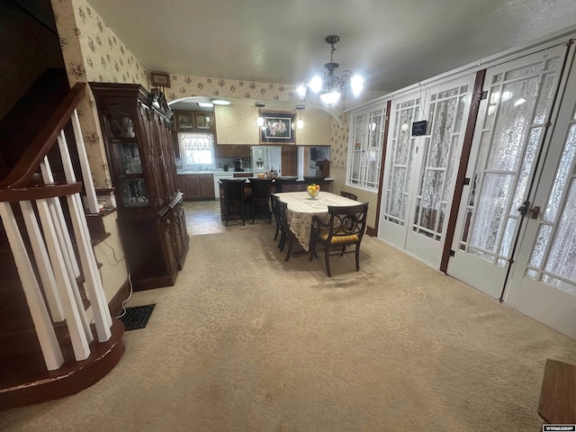 dining area featuring carpet