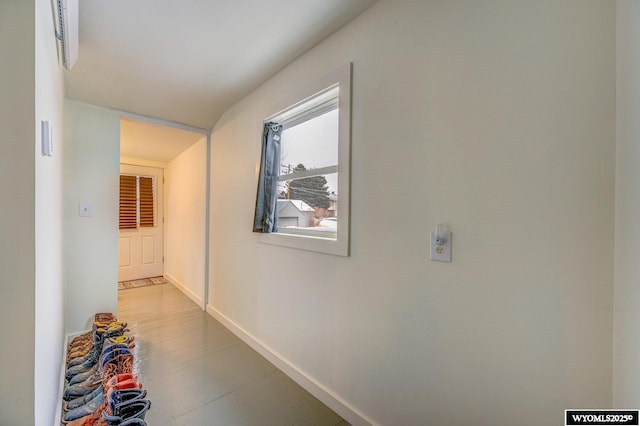 hall with hardwood / wood-style flooring