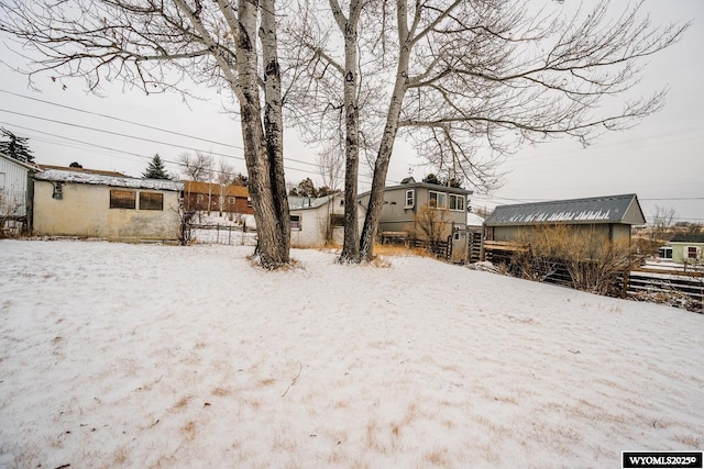 view of yard layered in snow