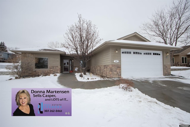 ranch-style house featuring a garage