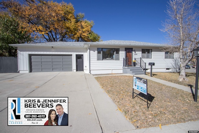 single story home featuring a garage