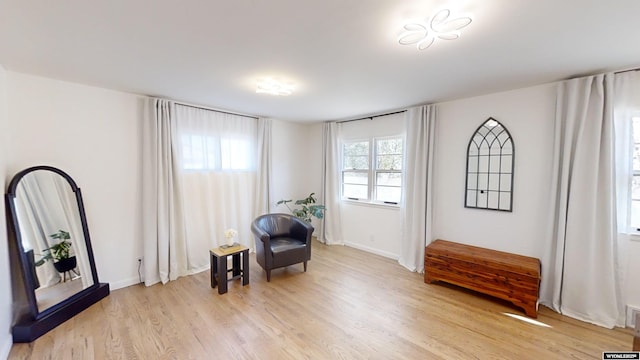 sitting room with light hardwood / wood-style floors