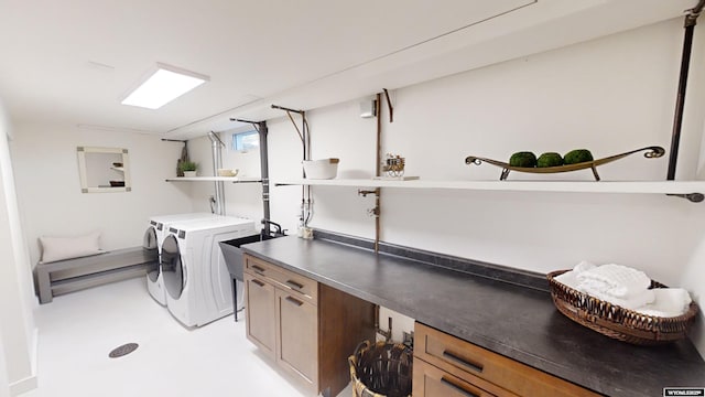 clothes washing area featuring washer and dryer