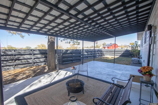 deck featuring a patio and a fire pit