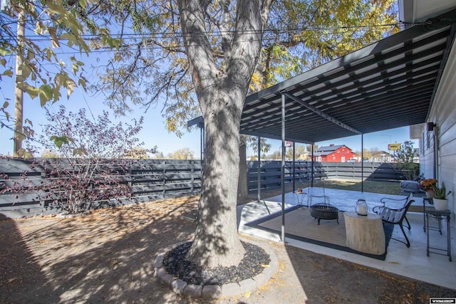 view of patio / terrace featuring an outdoor fire pit