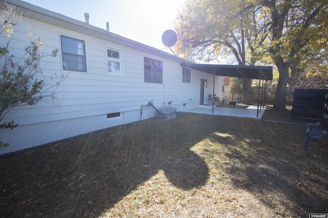 rear view of property featuring a patio area