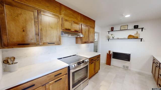 kitchen with backsplash and electric stove