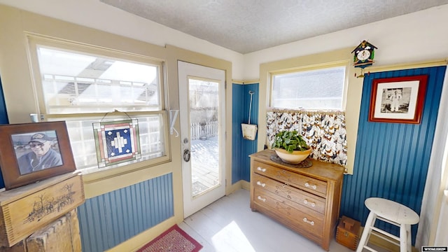 entryway featuring a textured ceiling