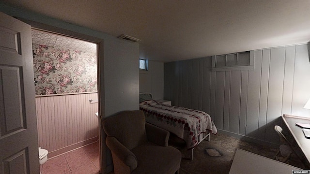 bedroom with light tile patterned floors