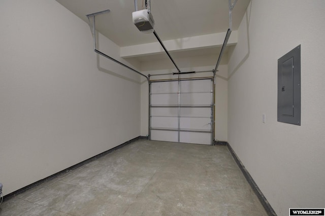 garage with a garage door opener and electric panel