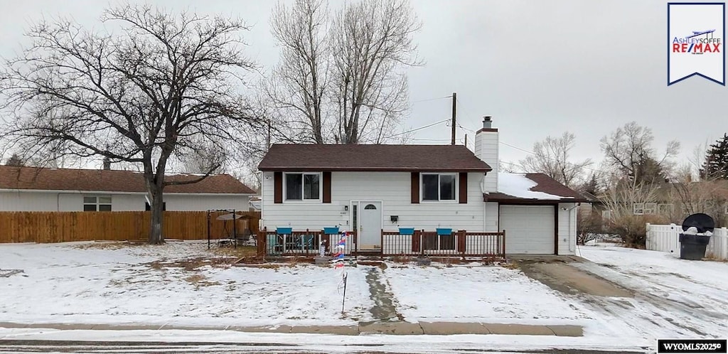 split foyer home featuring a garage