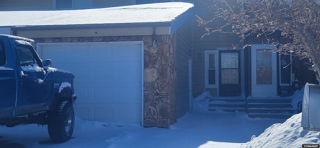 view of snow covered garage