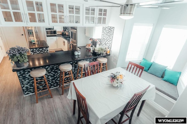 dining space featuring light hardwood / wood-style floors