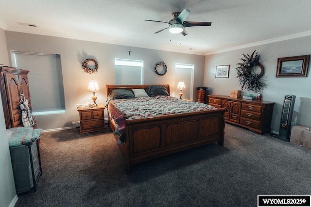 carpeted bedroom featuring ornamental molding and ceiling fan