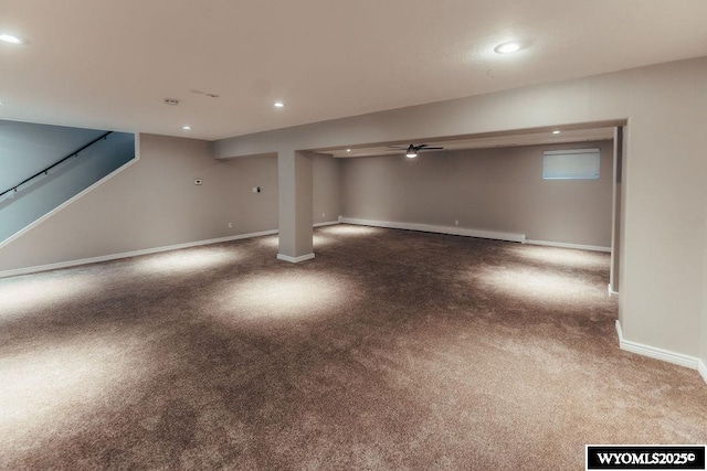 basement with a baseboard radiator and carpet