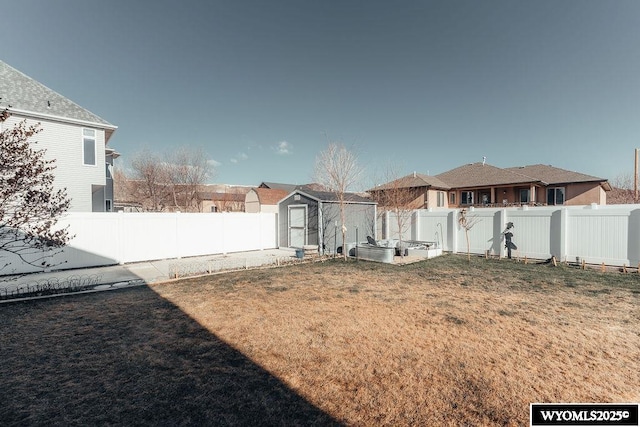 view of yard featuring a storage unit