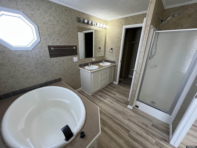 bathroom featuring hardwood / wood-style flooring, plus walk in shower, a textured ceiling, and crown molding