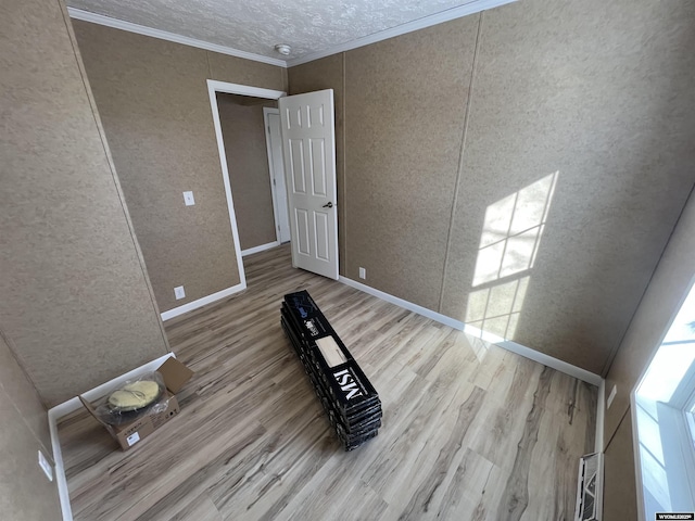 interior space featuring hardwood / wood-style flooring and crown molding