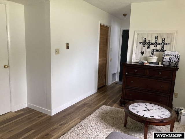 sitting room featuring dark hardwood / wood-style floors