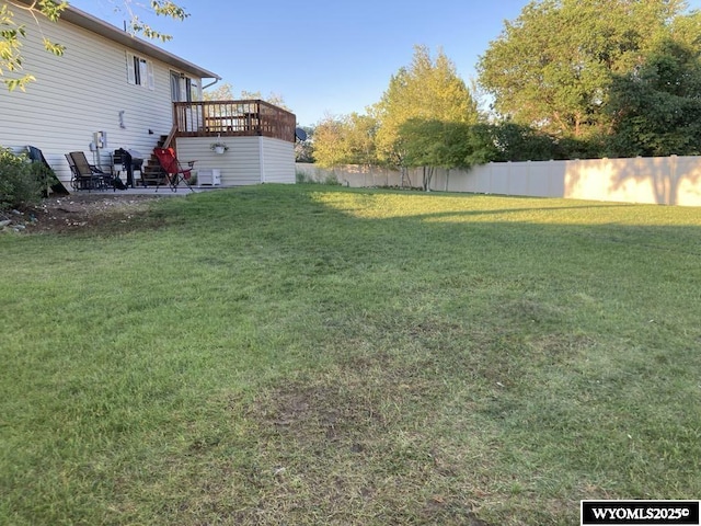 view of yard with a wooden deck