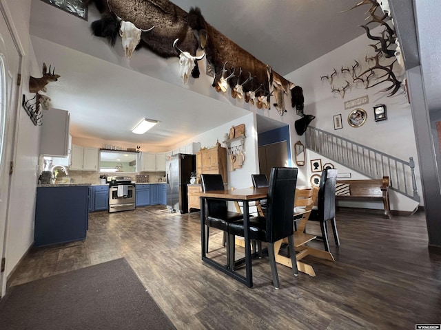 dining area featuring dark hardwood / wood-style flooring and sink