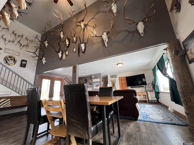 dining room with dark wood-type flooring and french doors