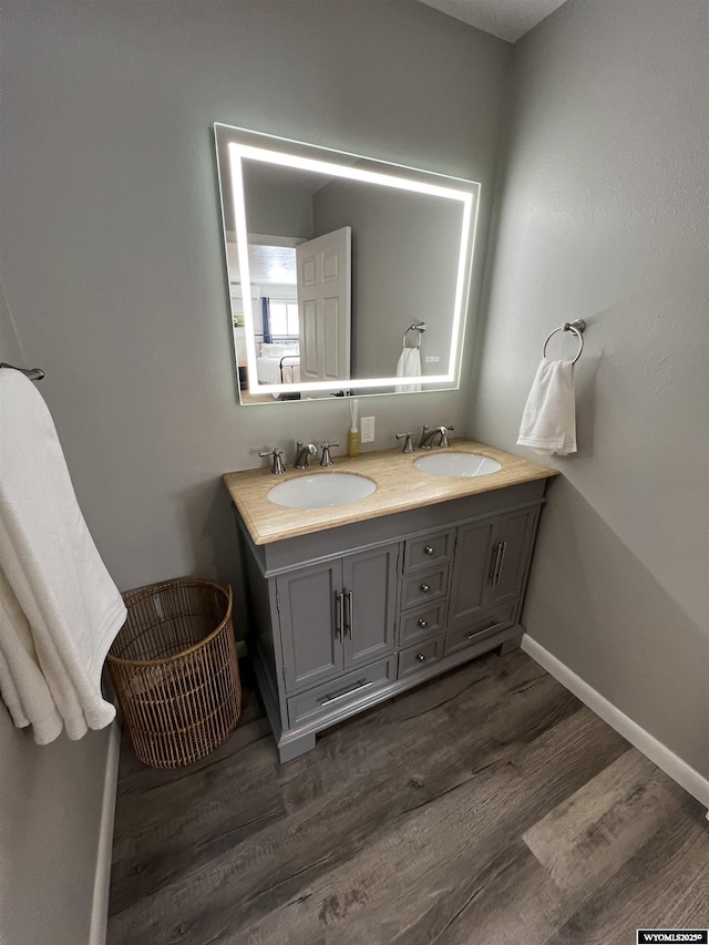 bathroom featuring vanity and hardwood / wood-style floors