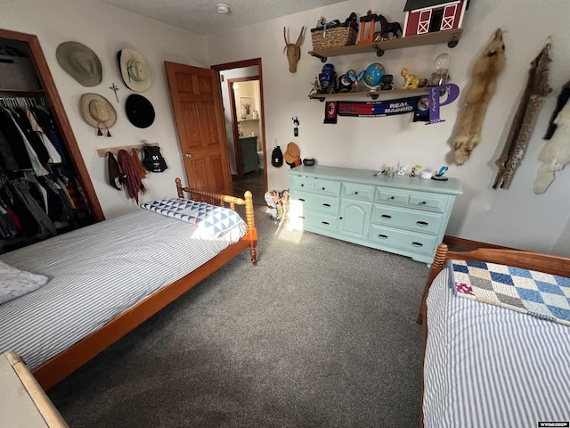 carpeted bedroom featuring a closet