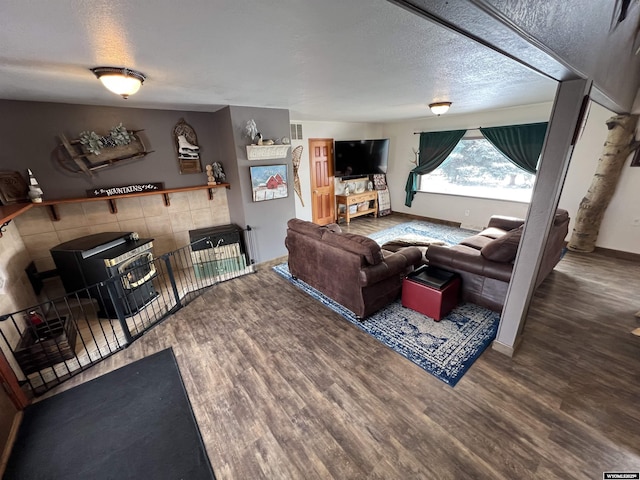 living room with hardwood / wood-style floors and a textured ceiling