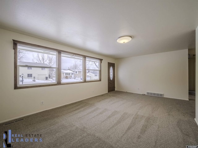 unfurnished room with carpet