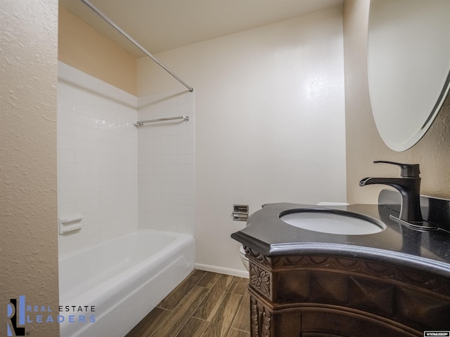 bathroom with vanity and shower / washtub combination