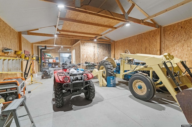 garage featuring wooden walls