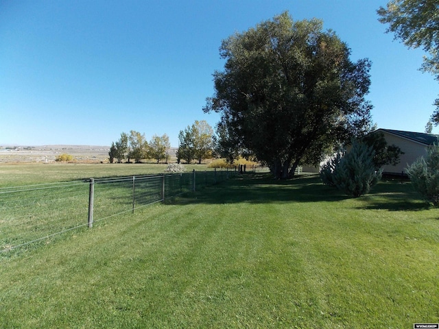 view of yard with a rural view