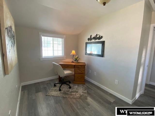 home office with baseboards, lofted ceiling, and wood finished floors