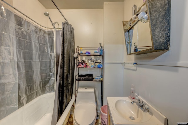 full bathroom featuring shower / bath combination with curtain, toilet, and sink