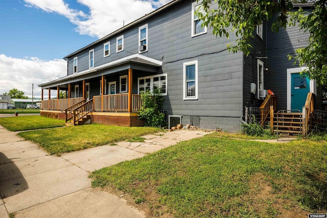 view of front of house with a front lawn and a porch