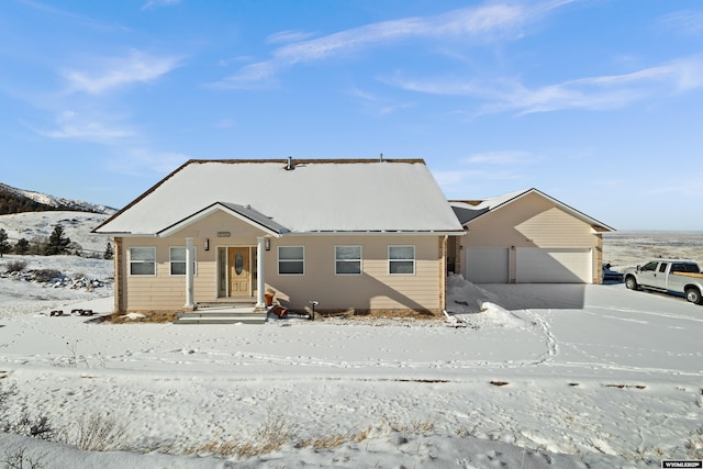 view of front of house with a detached garage