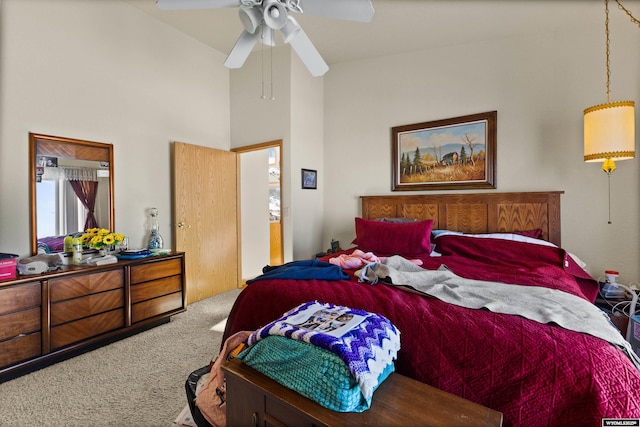 bedroom featuring ceiling fan, carpet flooring, and high vaulted ceiling