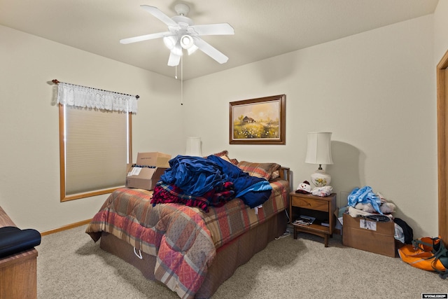 bedroom with baseboards, carpet floors, and a ceiling fan